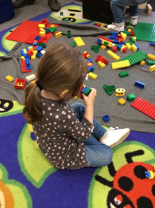 Clara playing with lego